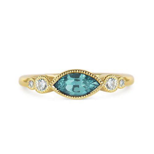 BLUE ZIRCON MARQUISE BAND IN YELLOW GOLD - ALL RINGS