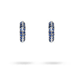 KNIFE EDGE SMALL HUGGIE HOOPS WITH BLUE SAPPHIRE IN WHITE GOLD - 