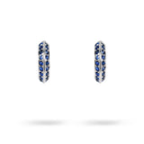 KNIFE EDGE SMALL HUGGIE HOOPS WITH BLUE SAPPHIRE IN WHITE GOLD - 