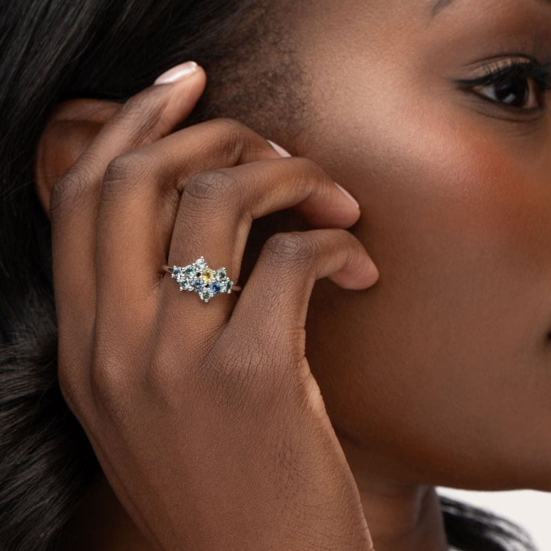 CLUSTERED RING IN 14 KARAT WHITE GOLD WITH BLUE GREEN SAPPHIRE - ALL RINGS