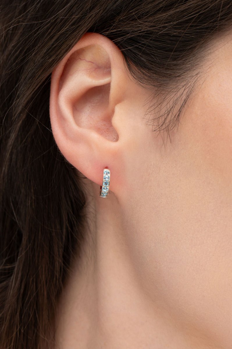 BLUE TOPAZ HUGGIE EARRINGS IN STERLING SILVER - EARRINGS