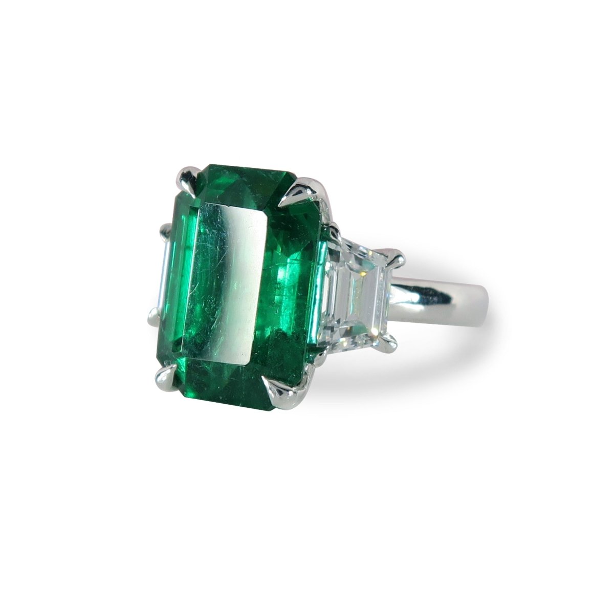 CUSTOM EMERALD & DIAMOND THREE-STONE RING IN PLATINUM -