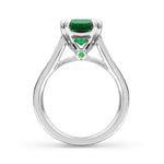 EMERALD RING WITH DOUBLE TEARDROP CLAWS -