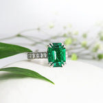 EMERALD RING WITH DOUBLE TEARDROP CLAWS -
