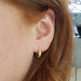 KNIFE EDGE HUGGIE HOOPS IN YELLOW GOLD -