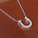 HORSESHOE DIAMOND PENDANT IN WHITE GOLD - NECKLACES
