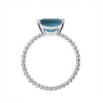 TESSA RING WITH EMERALD CUT BLUE TOPAZ IN WHITE GOLD - ANNIVERSARY & CELEBRATION RINGS