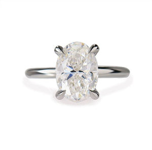 OVAL DIAMOND WITH TEAR DROP CLAWS IN PLATINUM - ALL ENGAGEMENT RINGS
