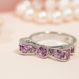 BOW RING WITH PINK SAPPHIRE IN WHITE GOLD - ALL RINGS