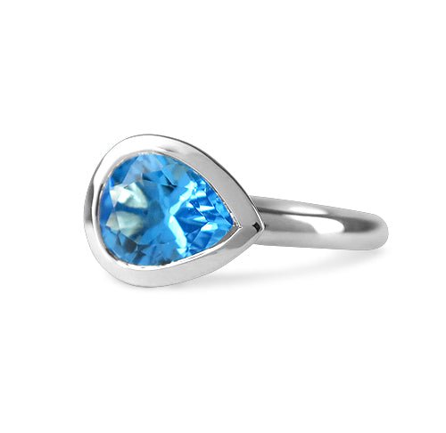 BLUE TOPAZ PETAL RING IN STERLING SILVER - ALL RINGS